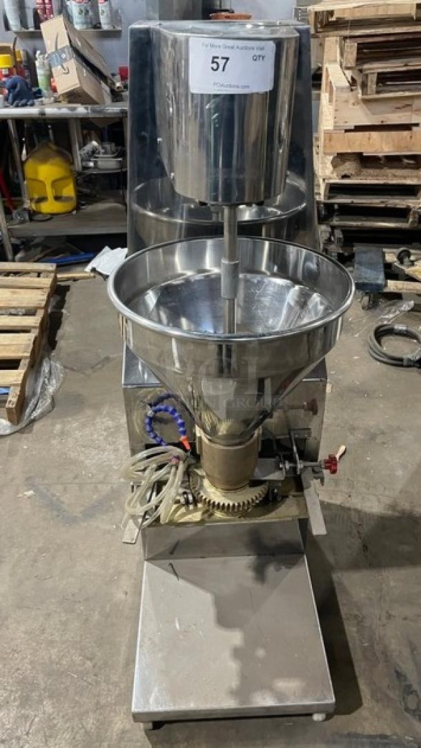 Commercial stainless steel meatball forming machine, electric-powered, 220V 3-phase. Heavy-duty construction, industrial setting.