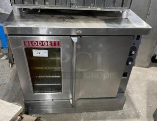 Blodgett commercial stainless steel single stack convection oven, electric powered, with thermostatic control and wired rack.