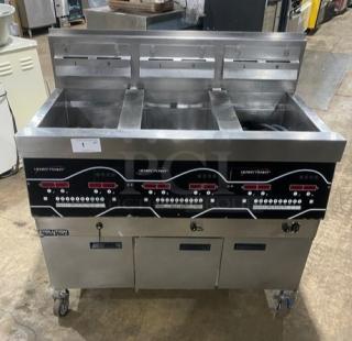 Henny Penny Evolution Elite EEG253 triple bay fryer, stainless steel, natural gas, backsplash, basket hanger, on casters.