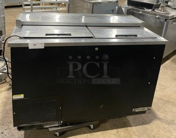 Beverage-Air DW49 black 50" bottle cooler, stainless steel top, double slide lids, SN: 8007027, in warehouse setting.