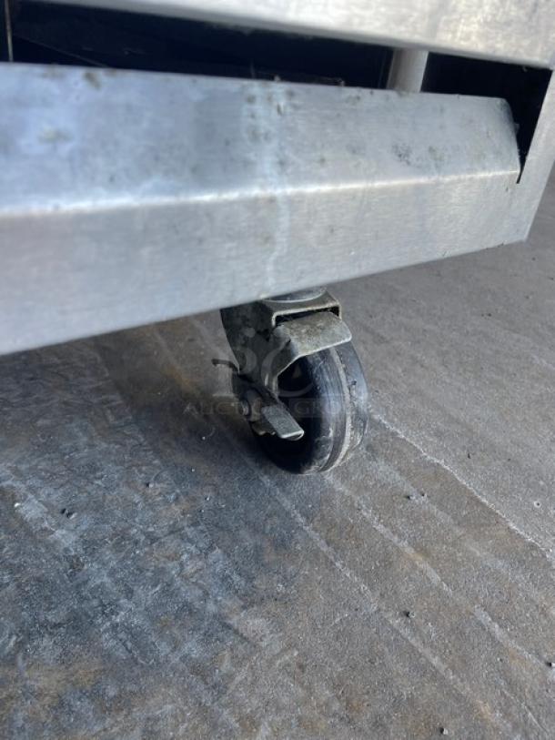 Beverage-Air stainless steel reach-in freezer on caster. Model KF24-1AS, Energy Star certified, with poly-coated wired rack.