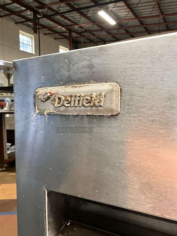 Delfield 6000XL reach-in refrigerator, superb condition, stainless steel finish, visible brand label, 115V, fully tested.