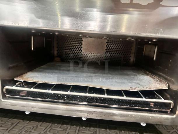 TurboChef Encore Rapid Cook Oven, 208/240V, in exceptional condition. Interior shows racks and metal plate, fully tested.