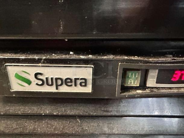 Supera G1M-16-B-1 glass door refrigerator control panel, featuring brand label and digital temperature display.