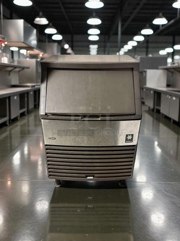 Pristine Manitowoc Q210 commercial undercounter ice machine, dice cube ice, fully tested, excellent condition, model label visible.