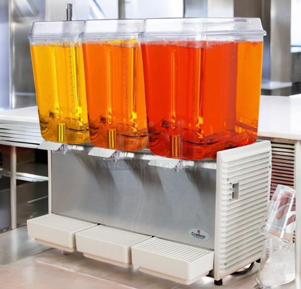 Crathco D35-4 refrigerated beverage dispenser, 4-flavor, excellent condition, 115V, fully tested, clear and orange tanks.