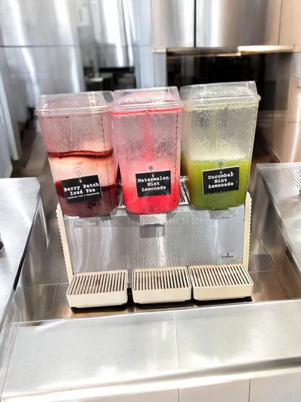 Crathco D35-4 beverage dispenser, 4-flavor, excellent condition, labels show flavors: Berry Patch Iced Tea, Watermelon Mint Lemonade.