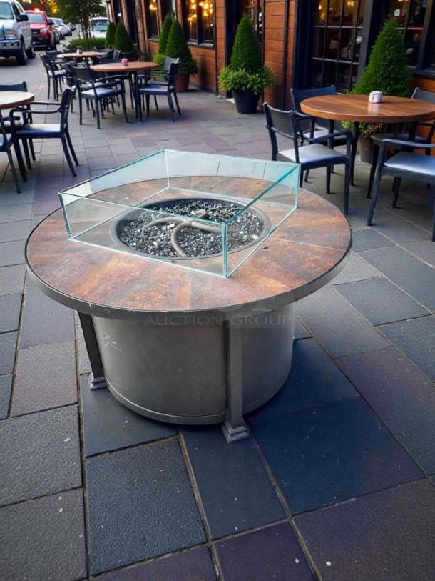Pristine round gas fire pit table by Outdoor Living, for natural gas/propane. Glass guard, inspected, like new condition.
