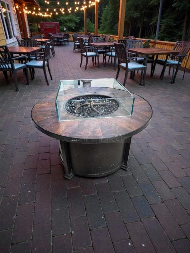 Pristine round gas fire pit table by Outdoor Living. Natural gas/propane, fully inspected, commercial patio use.