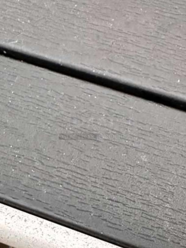 Set of 4 weather-resistant outdoor patio tables, commercial grade, outstanding condition, wood-texture surface.