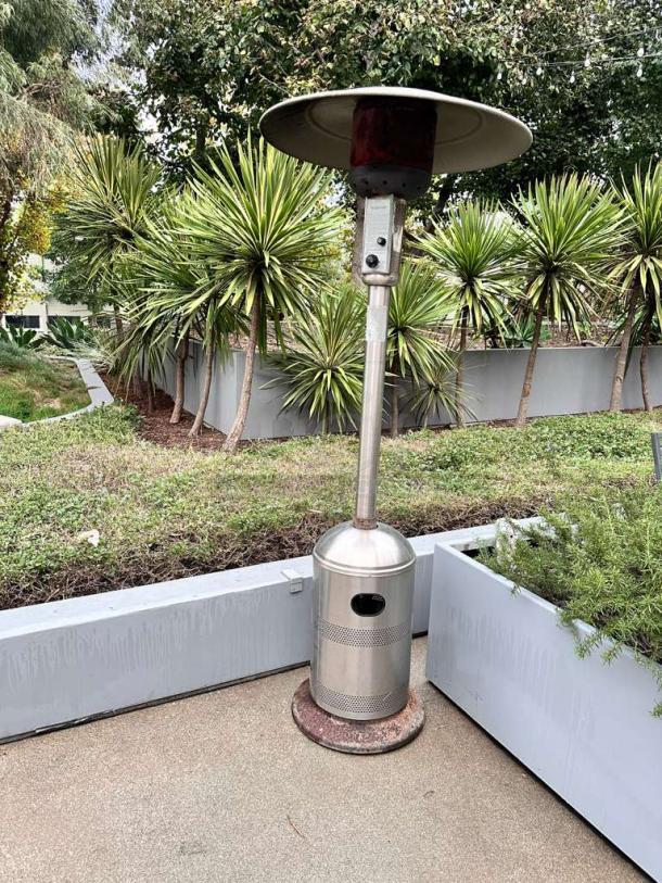 Stainless steel mushroom-top outdoor patio heater in superior condition, commercial grade, tested and ready to use.
