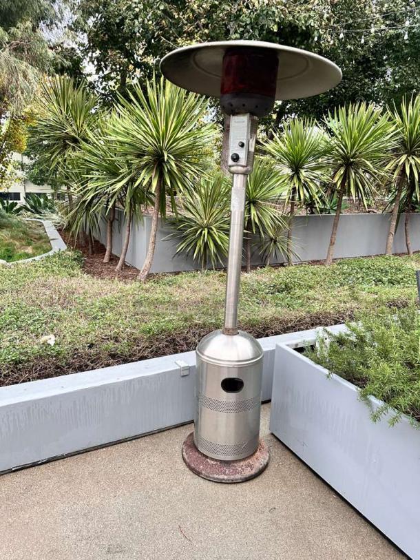 Stainless steel mushroom-top patio heater in superior condition, commercial grade, tested, ready to use.