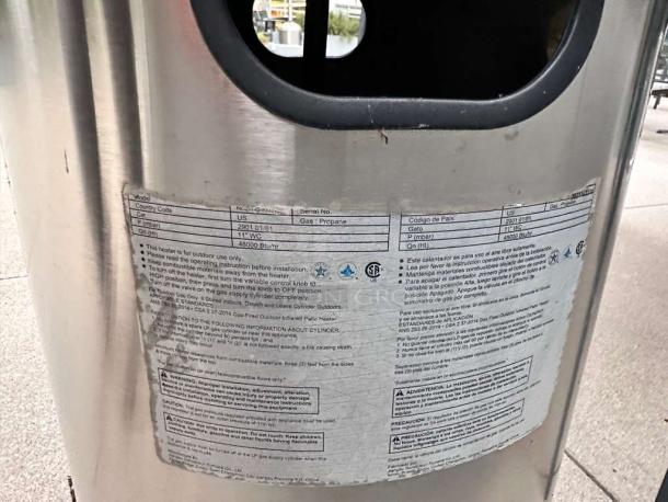 Three commercial-grade stainless steel outdoor patio heaters with mushroom tops. Superior condition, tested and ready to use. Labels detail usage instructions and emissions compliance.