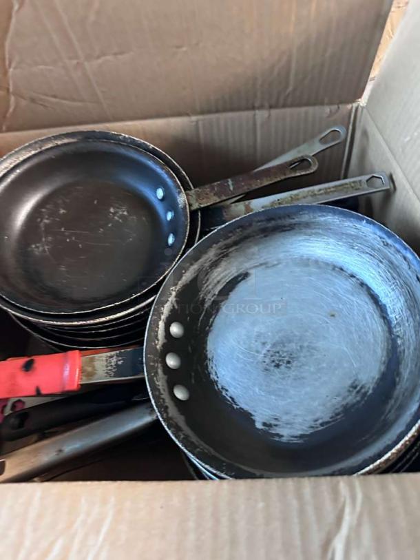 Lot of 22 commercial frying pans in outstanding condition. Fully inspected, ready for use, visible wear on handles.