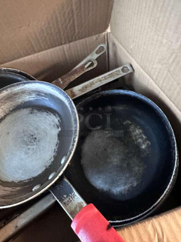 Lot of approximately 22 commercial frying pans in outstanding condition, fully inspected, ready for use, with visible grips.