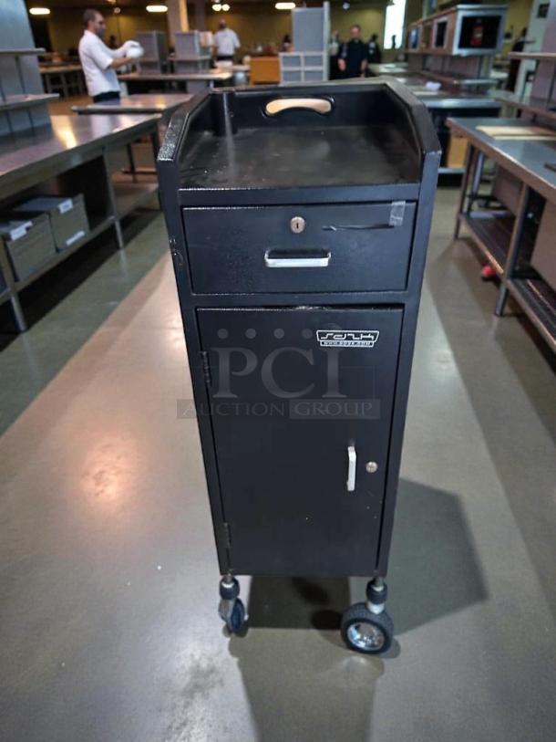 Black restaurant service station cabinet, pristine condition, lockable drawer, bottom storage, on wheels, fully tested, ready to use.