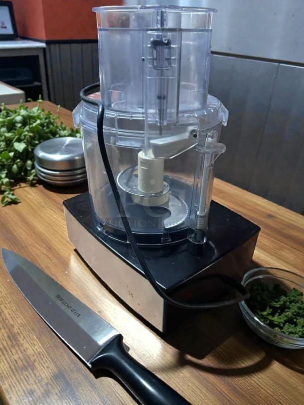 Cuisinart 14-Cup Food Processor in outstanding condition, clear bowl, stainless base, fully tested, model label visible.