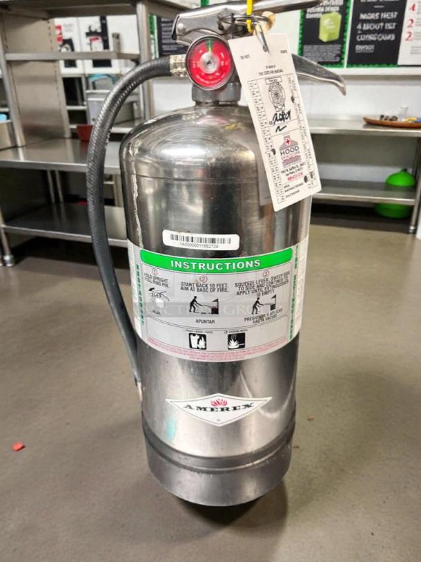 Amerex C260 commercial wet chemical fire extinguisher in superb condition, with inspection tag, stainless steel body, and hose.