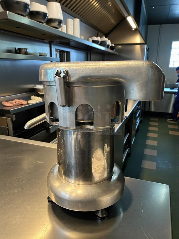 Uniworld UJC-750E 17" electric juice extractor in excellent condition, stainless steel, with automatic pulp extractor.