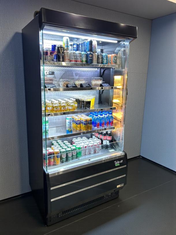 Turbo Air TOM-40B-SP-N merchandiser cooler in premium condition, fully stocked, stainless steel finish, tested and working.