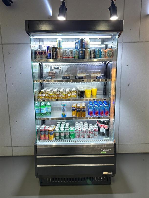 Turbo Air TOM-40B-SP-N vertical open air merchandiser cooler, fully stocked, premium condition, tested and working.