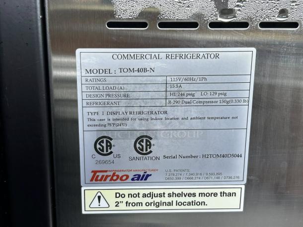 Turbo Air TOM-40B-SP-N cooler label indicating model, power ratings, design pressure, refrigerant type, and usage guidelines.