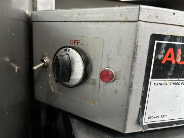 Optimal Automatics Autodoner 3PG gas broiler control panel, featuring an on/off switch and manufacturer label.