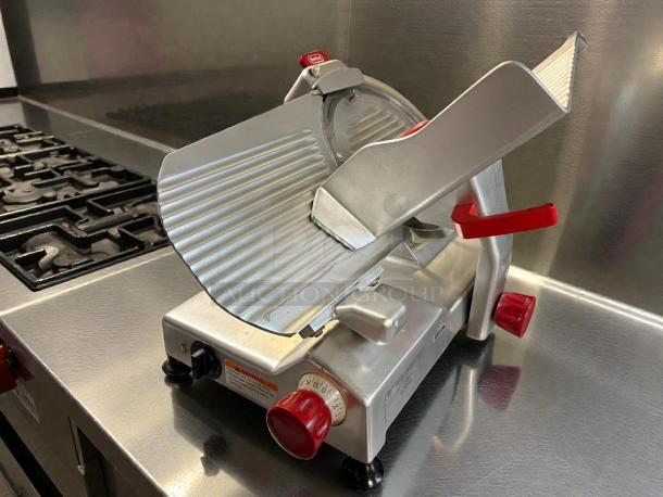 Berkel B12-SLC 12" manual gravity-feed meat slicer, 1/2 HP, outstanding condition, tested and working, red controls.