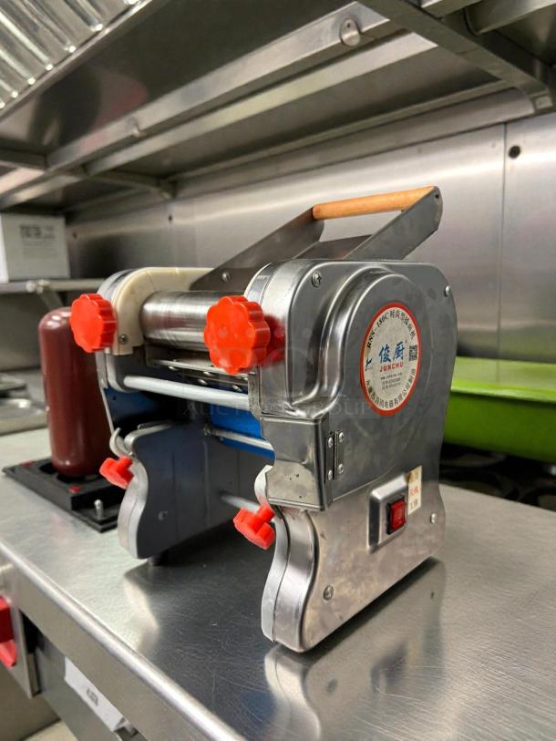 Junchu RSS-180C stainless steel pasta maker in outstanding condition. Features automatic dough rolling, 115V, tested and working.