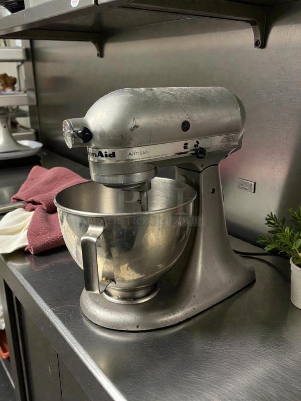 KitchenAid Artisan 5 Qt Stand Mixer, pristine condition, 115V, silver finish, fully tested, on a kitchen counter.