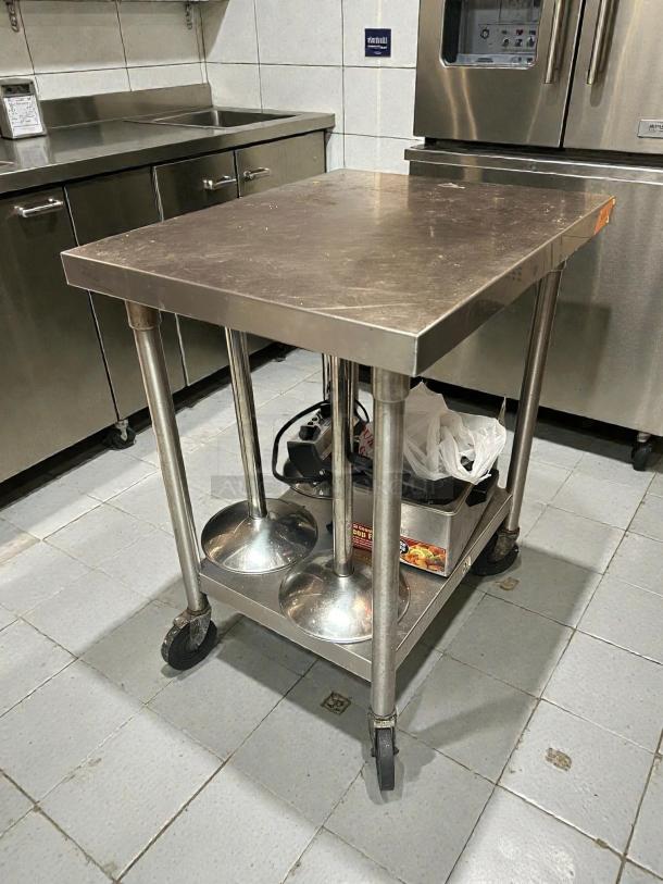 Immaculate Omniteam 24"x24" stainless steel work table with casters, smooth rolling, tested, ready for use.