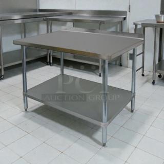 GSW 48" x 30" stainless steel work table with rear upturn, superior condition, sturdy commercial build.