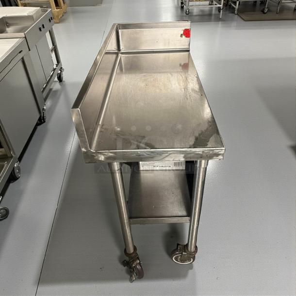 Omniteam 17” stainless steel worktop table with backsplash, casters, pristine condition. Fully tested and working.