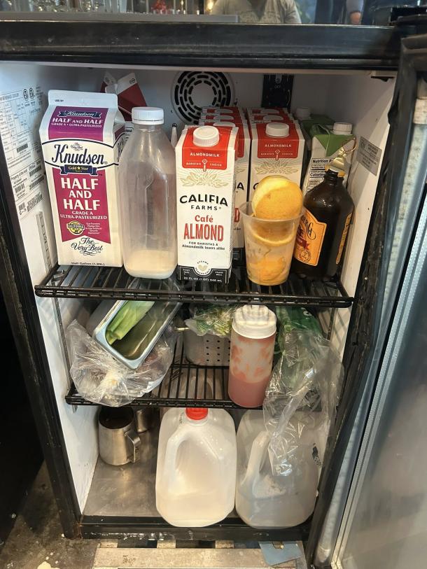 IDW GCG-7 countertop glass door cooler, 115V, in premium condition, showing contents on shelves, fully tested and working.