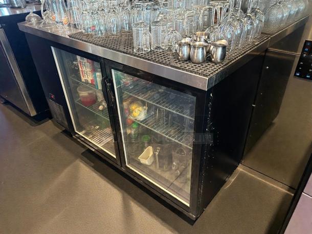 Dukers DBB60-H2 two-section glass door bar cooler, pristine condition, fully tested, stocked interior, visible temperature controls.