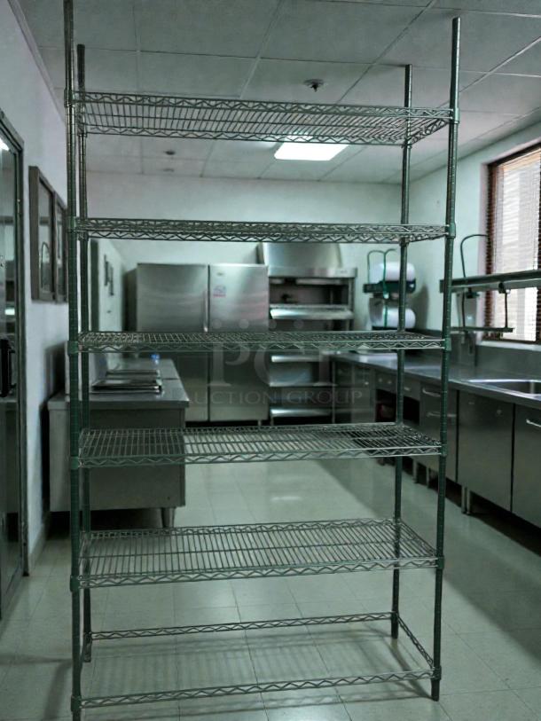 Titan 47.5" x 18" green epoxy wire shelving in prime condition, ideal for wet environments. Five-tier, commercial-grade.