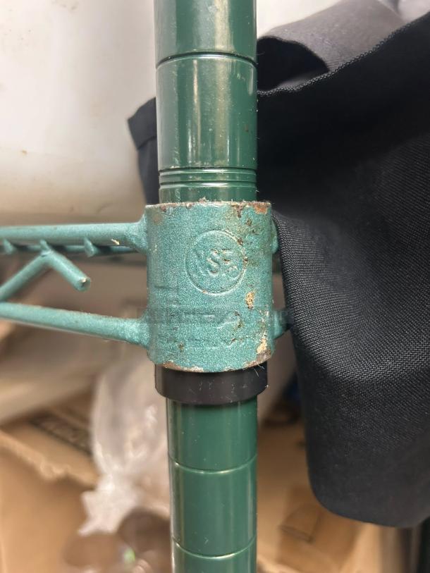 Titan commercial green epoxy wire shelving, 47.5" x 18", shows slight wear. Ideal for wet environments. "S5" marking visible.