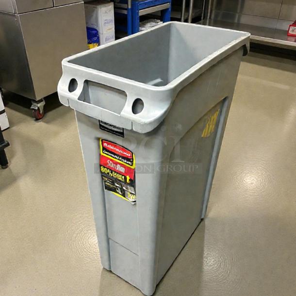 Rubbermaid Slim Jim 23-Gallon Trash Receptacle, grey, immaculate condition, with labels indicating brand and model.