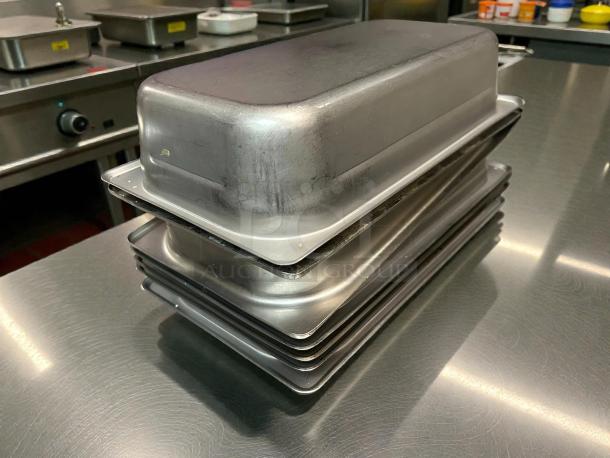 Stack of Carlisle 607132 DuraPan™ 1/3 Size Stainless Steel Steam Table Pans, 2 1/2" Deep, anti-jam, superior condition.