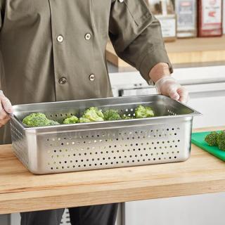 Choice full-size perforated stainless steel steam table pan, 6" deep, outstanding condition, fully tested. Contains broccoli.