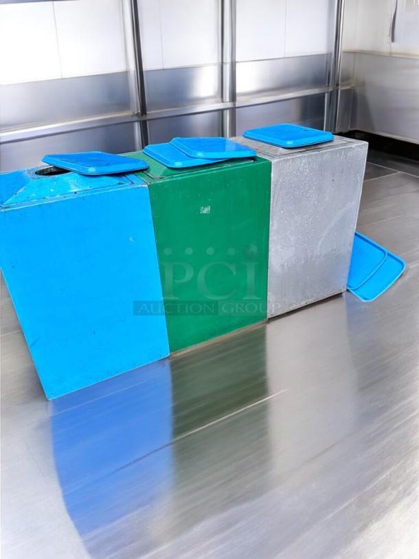 Commercial-grade outdoor trash containers in immaculate condition. Heavy-duty plastic with blue and green lids, fully functional.