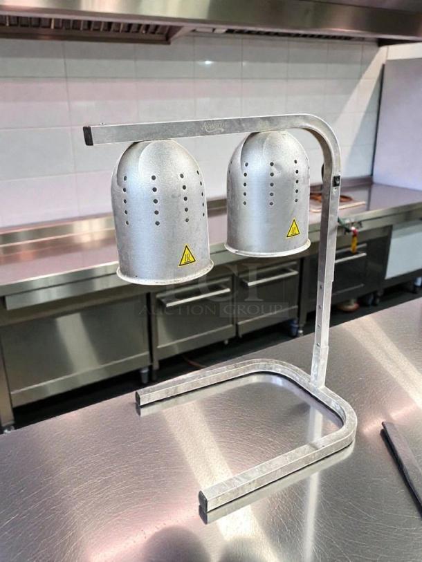 Stainless steel dual head commercial heat lamp food warmer, premium condition, tested and working, with caution labels.