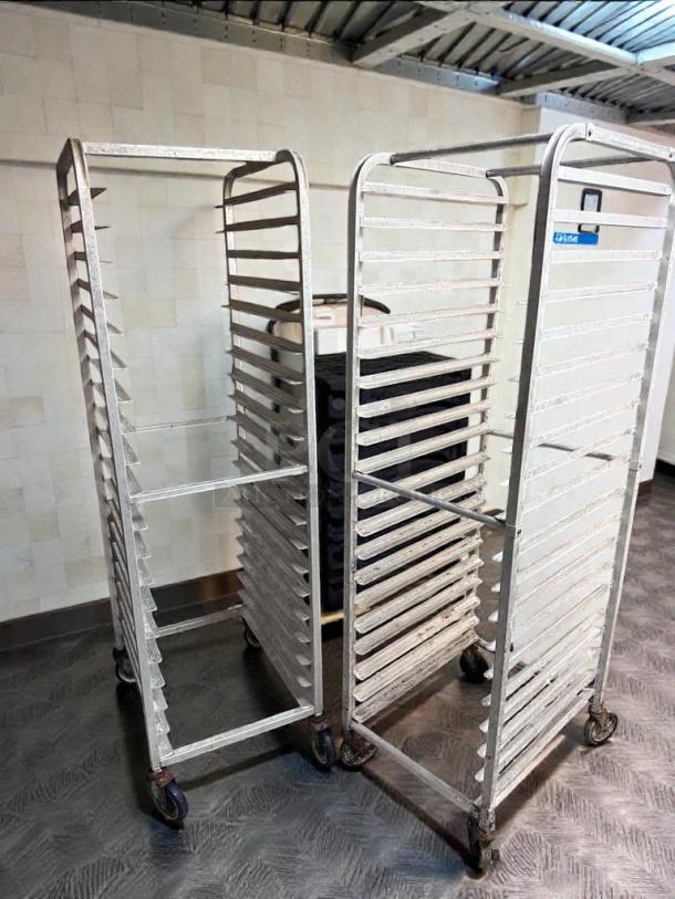 Mobile aluminum speed racks, full size, for sheet pans; used but in superior condition. Set of 2, commercial bakery equipment.