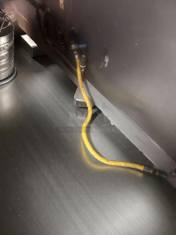 Commercial gas appliance connector hoses in prime condition, fully inspected, yellow, generic make, ready for use.