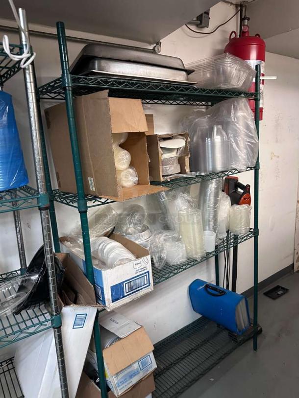 Commercial wire storage rack with multiple shelves, in excellent condition, filled with containers and boxes, heavy-duty design.