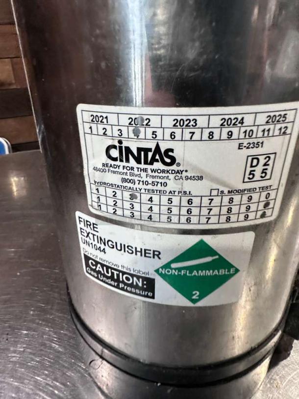 Cintas stainless steel commercial fire extinguisher, Type B:C:D, excellent condition, inspected, tagged, non-flammable label.