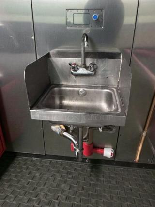 Commercial stainless steel wall-mounted hand sink with faucet and side splash, excellent condition, tested and ready for use.