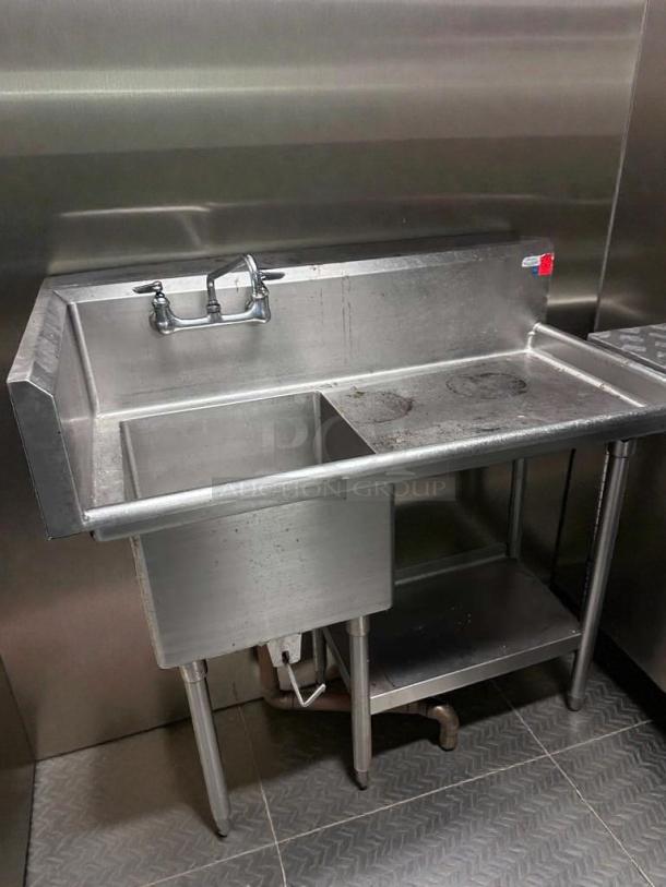 Stainless steel commercial prep sink with backsplash, undershelf, and faucet. NSF certified, tested, excellent condition.
