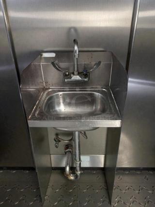 Like new stainless steel commercial hand sink, tested and working, features durable faucet and backsplash.