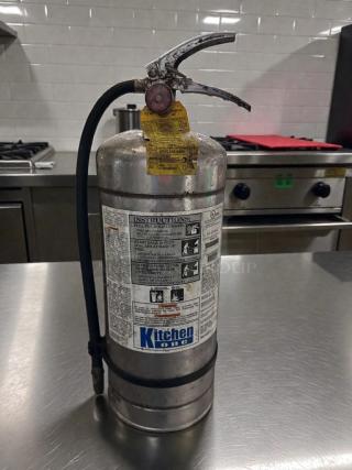 Kitchen One Model AD-576822 Class K fire extinguisher in outstanding condition, tested and working, with visible instructions and tag.